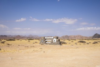 Stone entrance sign of Namib-Naukluft National Park in Namibia- 27 August, 2025: surrounded by