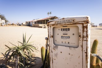 Old rusty fuel pump in Solitaire, Namibia - 27 August, 2025: set in a desert landscape with cacti,