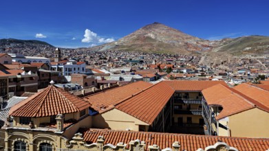 Red tiled roofs with a mountain view in the background on a clear day, the Cerro Rico silver