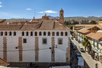 Historic buildings overlooking a main street and the surrounding mountains, The streets of the
