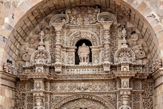 Detailed stone decorations and reliefs on a historic building, The churches of the city of Potosi
