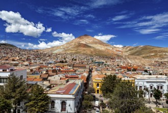 Lively city in front of a high mountain under an expressionist sky, the Cerro Rico silver mountain