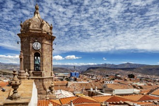 Bell tower with a view of a vast urban landscape and mountains under a clear sky, The churches of