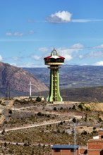 Large observation tower on a hill with sweeping views of the mountains and sky, the water tower of