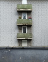 A house facade of an apartment block with bitumen clinker bricks and balconies in Wuppertal,