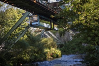 The Wuppertal suspension railway over the riverbed of the Wupper near the Kluse stop, Wuppertal,