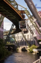 The Wuppertal suspension railway over the riverbed of the Wupper near the Kluse stop, Wuppertal,