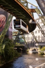 The Wuppertal suspension railway over the riverbed of the Wupper near the Kluse stop, Wuppertal,