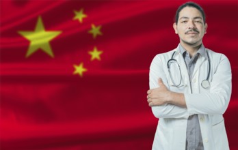 Male doctor on China flag. Doctor with crossed arms on China flag. China Health and Care concept
