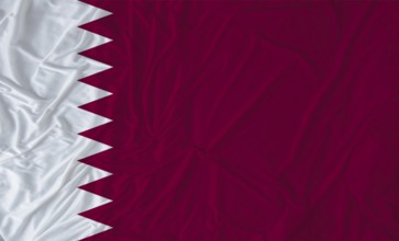 Qatar flag with fabric texture waving. Close up of flag of Qatar with cloth texture