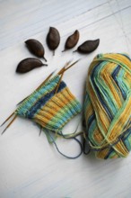 Coloured wool with started knitted sock