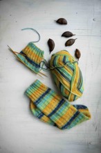 Coloured wool with started knitted sock