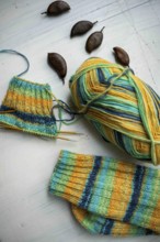 Coloured wool with started knitted sock