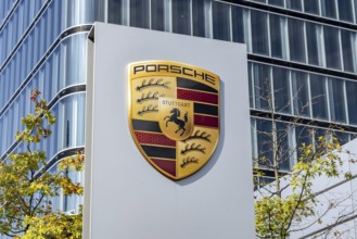 Porsche Centre Autohaus am Pragsattel. Porsche Design Tower skyscraper. Logo on a stele. Stuttgart,