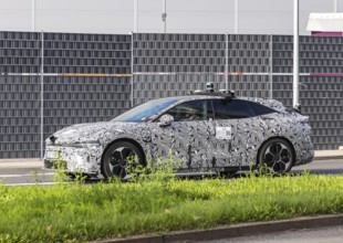 Prototype with camouflage livery on the road in Stuttgart. Zeekr Model 007 electric vehicle from