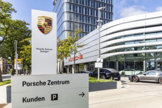 Porsche Centre Autohaus am Pragsattel. Porsche Design Tower skyscraper. Logo on a stele. Stuttgart,