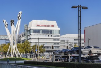 Porscheplatz with Porsche headquarters. Inspiration 911 artwork by Gerry Judah: three steles, each