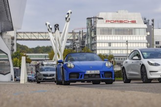 Porscheplatz with Porsche headquarters. Inspiration 911 artwork by Gerry Judah: three steles, each