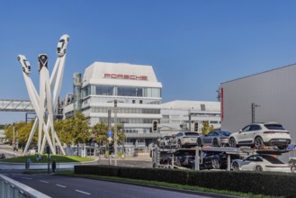 Porscheplatz with Porsche headquarters. Inspiration 911 artwork by Gerry Judah: three steles, each
