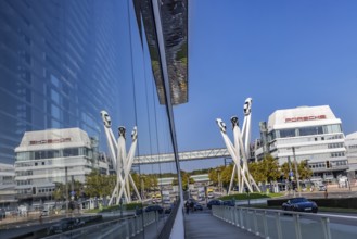 Porscheplatz with Porsche headquarters. Inspiration 911 artwork by Gerry Judah: three steles, each