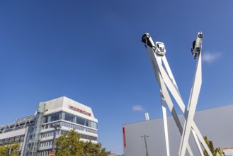 Porscheplatz with Porsche headquarters. Inspiration 911 artwork by Gerry Judah: three steles, each