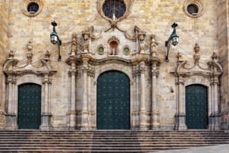 Monumental façade with three green double doors and complex decorations, impressive symmetry, The