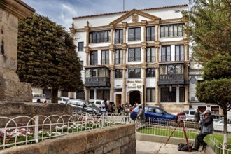Urban scene with art museum and people in a lively outdoor area, house facade in the city of Potosi