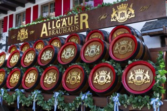 Representative wooden beer barrels on a wagon, Oberstdorf, Allgäu Alps, Bavaria, Germany