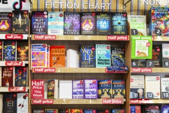 Fiction chart of bestselling books inside WH Smith, TG Jones, bookshop, England, UK