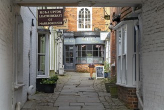 Specialist shops in historic alleyway of Old Hughenden Yard off the High Street in Marlborough,