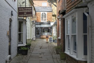Specialist shops in historic alleyway of Old Hughenden Yard off the High Street in Marlborough,