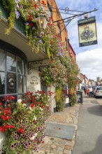 Colourful flowers in large window box and hanging baskets, Royal Oak public house, Marlborough,