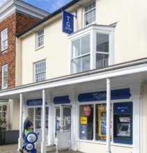 TG Jones shop signage rebranded WH Smith store, High Street, Marlborough, Wiltshire, England, UK