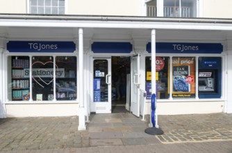 TG Jones shop signage rebranded WH Smith store, High Street, Marlborough, Wiltshire, England, UK
