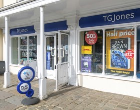 TG Jones shop signage rebranded WH Smith store, High Street, Marlborough, Wiltshire, England, UK