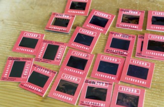 Red cardboard slide mounts some with written captions Ilford Ilfochrome transparency positive film,