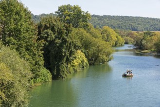Bank, boat on the river Meuse, Mouzon, Département Ardennes, Grand Est, France