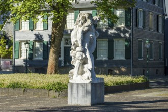 Detailed statue in front of a historic building with clear lines and soft shadows, statue The