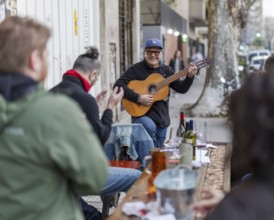 Street scene with musician, Palermo neighbourhood, Buenos Aires, capital of Argentina