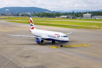 British Airways Passenger Airplane Taxiing on Runway in a Sunny Summer Day From the Airport in