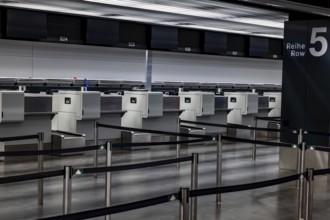 Illuminated and Empty Airport Check in Counter in Zurich Airport at Night in Kloten, Zurich, Zurich