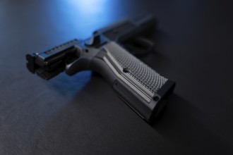 Modern Elegant Sport Handgun For IPDA with Blue Light on Grey Background in Switzerland