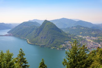 Panoramic View over Lake Lugano and Mountain View in the Swiss Alps and Cityscape in a Sunny Summer
