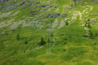 Electricity Pylon with Mountain View in the Swiss Alps in a Sunny Summer Day in Bernina,