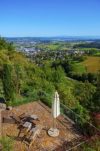 Panoramic View over City and Landscape with a Terrace with Chair and Parasol From Medieval Old Town