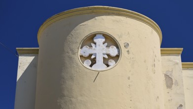 Primary school, Round tower with white cross on a beige wall under a clear sky, Historicism, Art