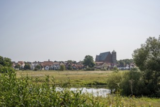 Rural village with church, surrounded by meadows. Quiet, peaceful countryside, cathedral, Verden an