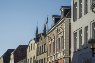 Row of historic buildings with ornate facades under a clear sky, Warendorf, Münsterland, North
