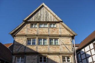 Large half-timbered house under a blue sky, representing traditional architecture, Warendorf,