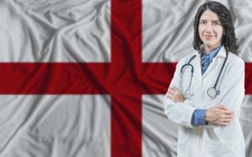 English medicine and healthcare concept. Doctor close up against England flag background